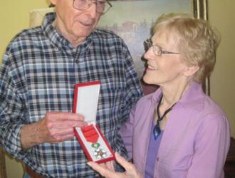 390th veteran Carl Crisp, seen here with his wife Rachel. Carl flew 35 missions and received the French Legion of Honour Medal
